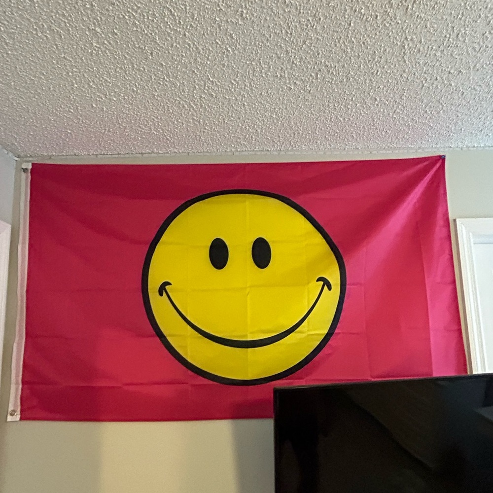 5 Feet by 3 Feet Pink Smiley Face Flag.